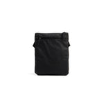 Mueslii crossbody, made of PU coated waterproof nylon, color black, back view.