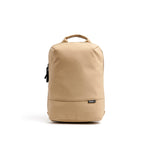 Mueslii small backpack, made of PU coated waterproof nylon, with a laptop compartment, color sand, front view.