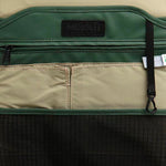 Mueslii small backpack, made of PU coated waterproof nylon, with a laptop compartment, color green, inside view.