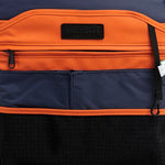 Mueslii small backpack, made of PU coated waterproof nylon, with a laptop compartment, color orange, inside view.