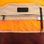 Mueslii small backpack, made of PU coated waterproof nylon, with a laptop compartment, color sand, inside view.
