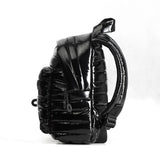 Mueslii original puffer extra small pack made of high density nylon and Ykk zips, color black, side view.